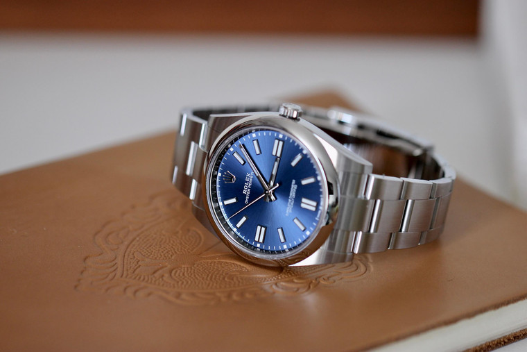 Available for sale pre-owned ROLEX Oyster Perpetual 41 with a bright blue dial and an Oyster bracelet M124300-0003 Complete with Box & Documentation.