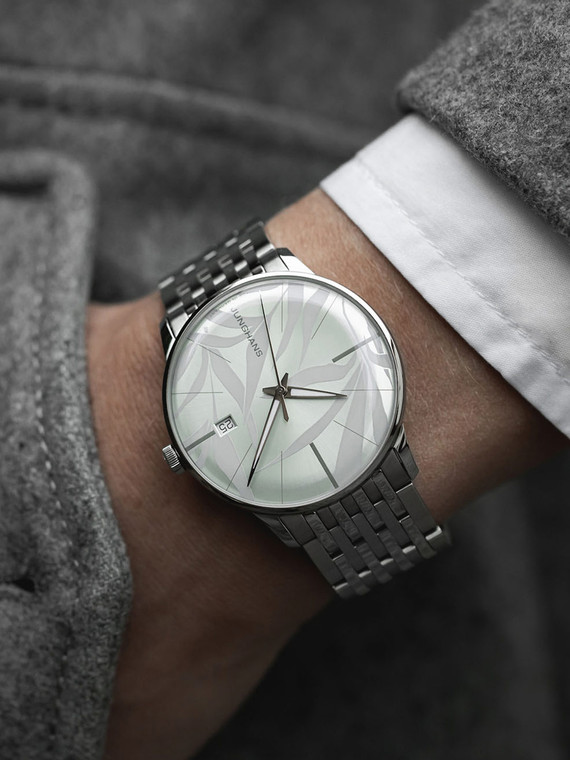 The Junghans Meister Automatic 27/4243.46 is a unisex dress watch. It has a 38.4 mm stainless steel case, a white artistic dial with a sunray finish, and a stainless steel strap. The watch also has a scratch-proof sapphire crystal back case and a folding clasp buckle.