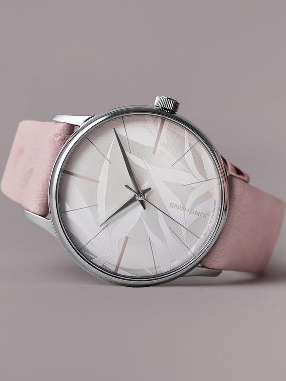 The Junghans 27/3242.00 Meister Damen Automatic Pink Bamboo Dial Pink Strap is a women's watch with a pink bamboo dial, pink leather strap, and stainless steel case. It has a 33.1 mm case width, 9.8 mm case depth, and 18–20 mm strap width. The watch also has an anti-reflective sapphire crystal, a convex dial, and diamond-cut dauphine hands.