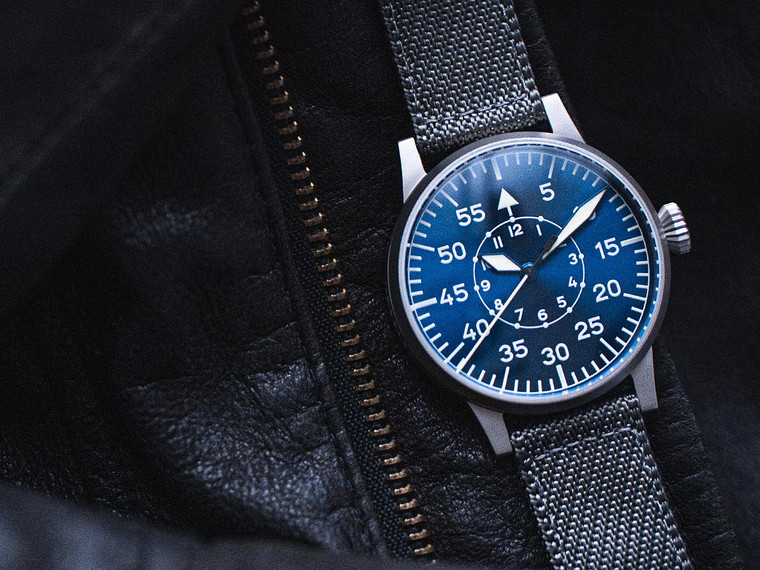 For sale from an Authorized Dealer. Blue Dial , Grey Strap. Made in Germany.   LACO 1925 PILOT WATCH ORIGINAL PADERBORN BLAUE STUNDE Made in Germany Ref 862082.  Free Shipping. 