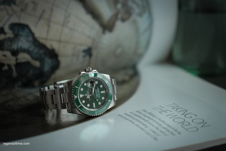 This Rolex Submariner 116610LV is a high-end mechanical wristwatch that boasts impressive technical features and exceptional craftsmanship. Its 40mm Oystersteel case is equipped with a Triplock winding crown and a helium escape valve, allowing it to withstand pressures of up to 300 meters (1,000 feet) underwater. The unidirectional rotatable green ceramic bezel features a 60-minute graduated scale for accurate diving time measurement.

Inside the case, the watch is powered by a self-winding mechanical movement entirely developed and manufactured by Rolex. The Calibre 3135 movement is a certified Swiss chronometer, which guarantees the watch's precision and reliability. It features a Parachrom hairspring and a large balance wheel with variable inertia for improved accuracy and shock resistance. The movement also provides a power reserve of approximately 48 hours.

This particular Submariner 116610LV is in mint condition, with no visible signs of wear or scratches. It comes complete with the original box, papers, and tags, attesting to its authenticity and provenance. The stainless steel Oyster bracelet with a Glidelock extension system is also in excellent condition, providing a comfortable and secure fit on the wrist.

Overall, this Rolex Submariner 116610LV is a top-of-the-line diving watch that combines advanced technical features with elegant aesthetics. It is a highly sought-after timepiece among collectors and enthusiasts alike, and this mint condition example is a rare find. If you're looking for a watch that can handle the most demanding underwater conditions while still looking stylish on land, this Submariner 116610LV is the perfect choice.